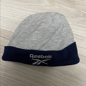 🆓 FREE with Purchase 
0-3 Month size 
Reebok Light Gray and Dark Blue Hat